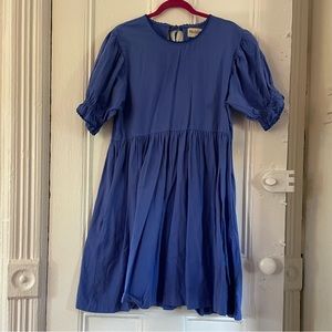 Noble tiered mini dress with puff sleeves, tie back and ric rac detail